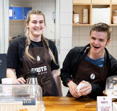 Two baristas working at Roots in UCC